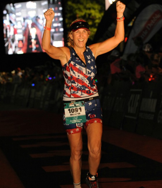 Jennifer at the finish line at IRONMAN Chattanooga.