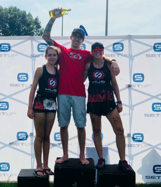 Team Hub member celebrating after a race.